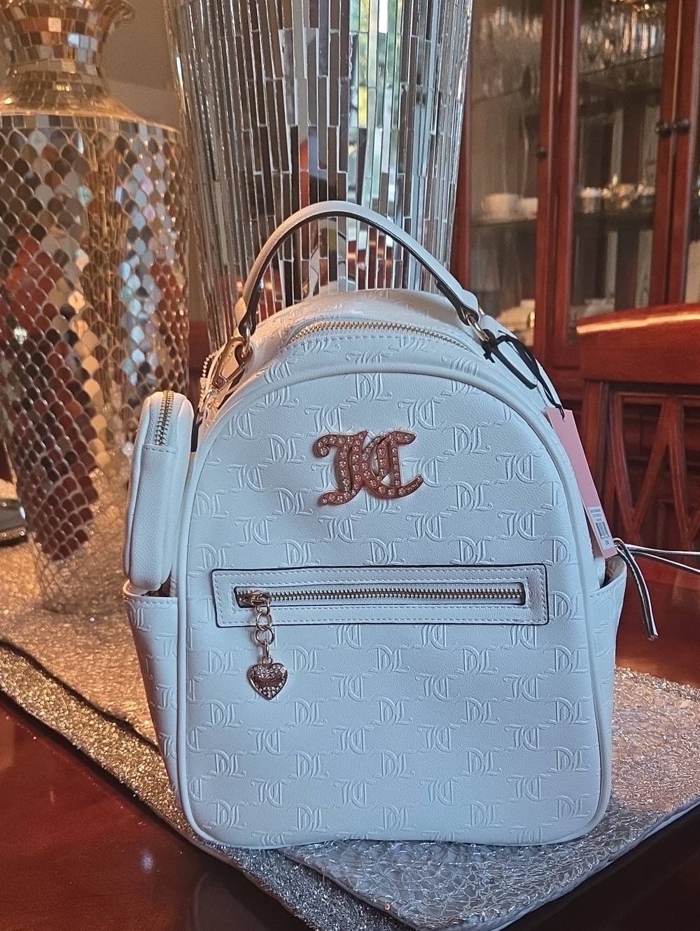Juicy Couture White Embossed Mini Backpack with Gold Logo Charm